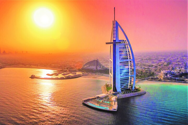 Experience Dubai's skyline illuminated at night with breathtaking views of Burj Khalifa and the enchanting Burj Al Arab all while savoring exquisite cuisine on this luxurious guided city tour.